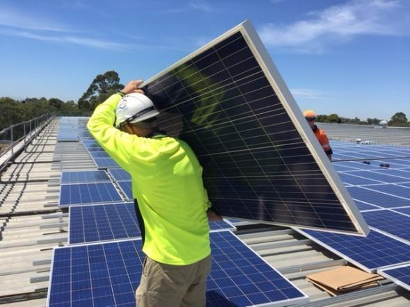 Man Installing Solar Panels Image