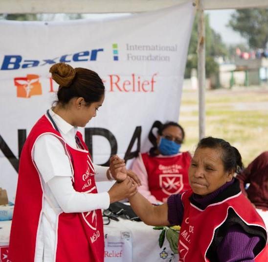 Volunteer Aid Assisting People in Mexico Image